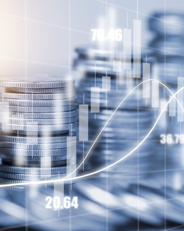Double exposure of coins stacking with investment graph chart and cityscape. It is symbol of stock value investment concept.