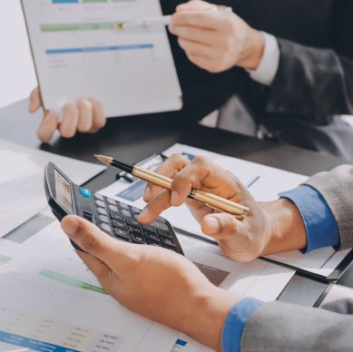 Accounting company provide finance and taxation planning for profitable cash flow, Auditor and accountant team working in office, analyze financial data and accounting record with calculator.Insight