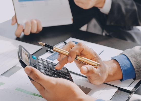Accounting company provide finance and taxation planning for profitable cash flow, Auditor and accountant team working in office, analyze financial data and accounting record with calculator.Insight